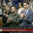 Zelensky in a military shirt stands next to Trudeau who is wearing a suit and clapping as others look on