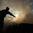 Silhouette of a man against a backdrop of smoke 