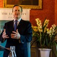 The former British prime minister David Cameron uses his hands to emphasise a point while speaking at an event 