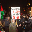 Woman with placard reading: Starmer blood on your hands
