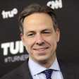 Jake Tapper grins during an event at Madison Square Garden in New York City