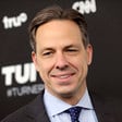 Jake Tapper grins during an event at Madison Square Garden in New York City