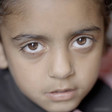 A Palestinian child looks into the camera