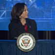 Kamala Harris stands at podium with vice presidential seal on it