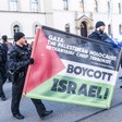 German police confiscate a banner saying Gaza: The Palestinian Holocaust and Netanyahu: Chief Terrorist 