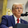 President Donald Trump behind a podium and microphone