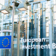 A facade with a blue and yellow logo and the words European Investment Bank 