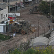 Armored vehicle on a road in a village 