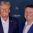 President Donald Trump stands next to Randy Fine, a state senator from Florida