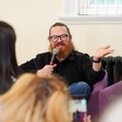 A man speaking into a microphone
