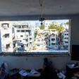 A view of devasted buildings, looking out through a window 