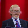 L. Brent Bozell III speaking into microphones