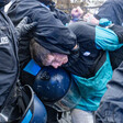 BERLIN, GERMANY - DECEMBER 27: Police detains a demonstrator as protesters march in support of Palestinians after gathering in front of Neukolln City Hall (Rathaus Neukolln) in Berlin, Germany on December 27, 2025.