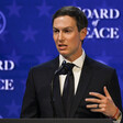 Jared Kushner stands at podium speaking