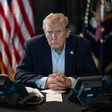 Trump at desk with telephones in front of him