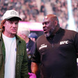 Theo Von wears a cap alongside Brad Tate at a UFC event at T-Mobile Arena in Las Vegas, Nevada