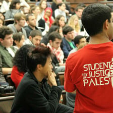 US students watch at a conference on Palestine