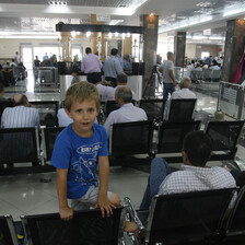 Palestinians wait at the Rafah border crossing to travel from Gaza to Egypt