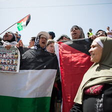 Women chant and carry banners