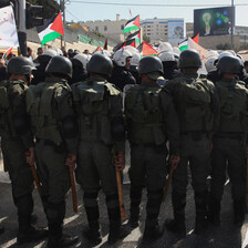 View of the backs of riot police at a demonstration