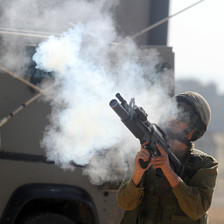 Israeli soldier fires tear gas rifle