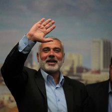 A smiling Ismail Haniyeh waves