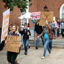 Young people carry signs in support of free speech, academic freedom and reinstatement of Steven Salaita