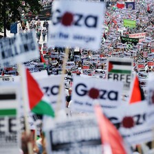 View of hundreds of signs and banners with Gaza and Palestine solidarity messages during massive London protest