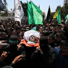 Photo shows Mazen al-Faqaha's body being carried through massive crowd