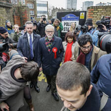 A man surrounded by cameras