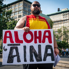 Man holds placard