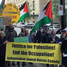 Vancouver demonstrators wave Palestinian flags and hold signs