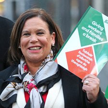 Woman holds up document