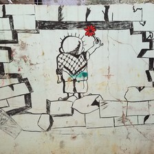 Image of boy holding a flower painted on a wall 