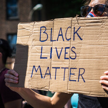 Protester holds sign reading Black Lives matter