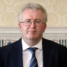 Man wearing spectacles and tie. 