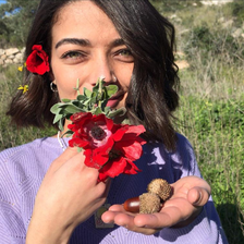 Palestinian student Mays Abu Ghosh holds flower