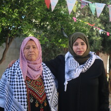 Two women pose for the camera