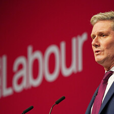 A man speaks from a podium