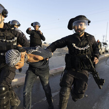 Heavily armed Israeli police arrest a young boy 