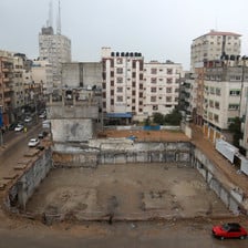 A space between housing blocs marks the place where al-Jawhara Tower used to stand