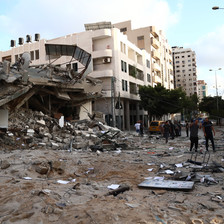 A scene of destruction beside a large building 