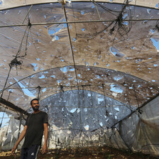 A man walks near the site of an Israeli attack on Gaza