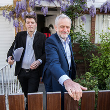 Two men leaving a house