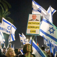 protestors wave Israeli flags and banners against Benjamin Netanyahu