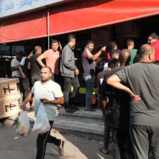 A line of people queuing for bread