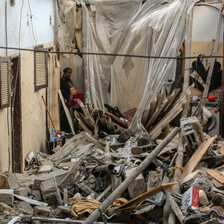 People search in what remains of a building in the southern Gaza city of Rafah 