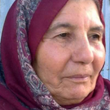 A portrait of a woman wearing a headscarf