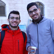 Two male friends smile for the camera