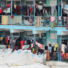 Tents and washing lines compete for space in a school